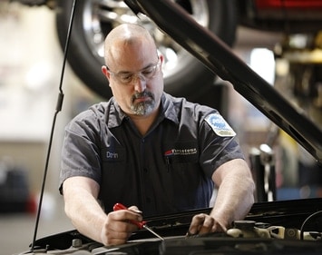 Darin working on a vehicle engine