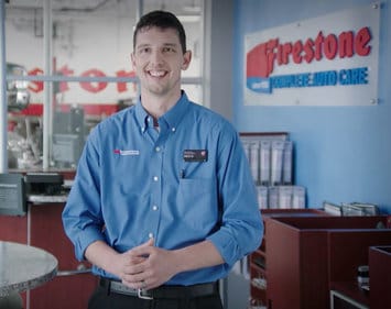 Firestone technician Nick standing in a Firestone office