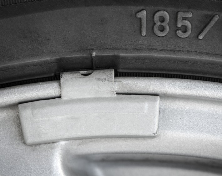 Close-up of tire balancing