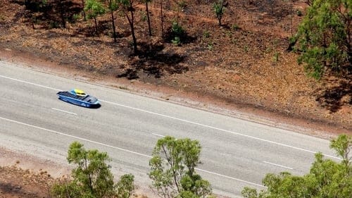 Blue solar car on the highway